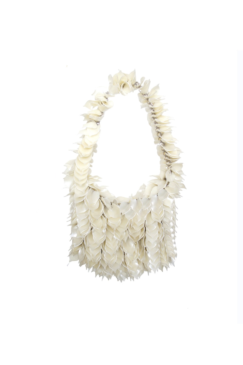 Millanne Tale Guiarete bag, a stylish top handle bag with sleek design and elegant craftsmanship, shown from a front view.