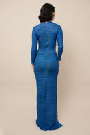 Maylé Vásquez NATIVA Maxi Dress featuring flowing fabric and vibrant patterns, perfect for casual or elegant summer wear.