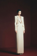 Maison Des Copains Miranda sheath gown with peak lapel, floor-length design, elegant formal dress for special occasions.