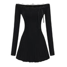 Black Jenna mini dress by Nana Jacqueline featuring a fitted silhouette and stylish design, displayed on a hanger.