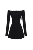 Black Jenna mini dress by Nana Jacqueline featuring a fitted silhouette and stylish design, displayed on a hanger.
