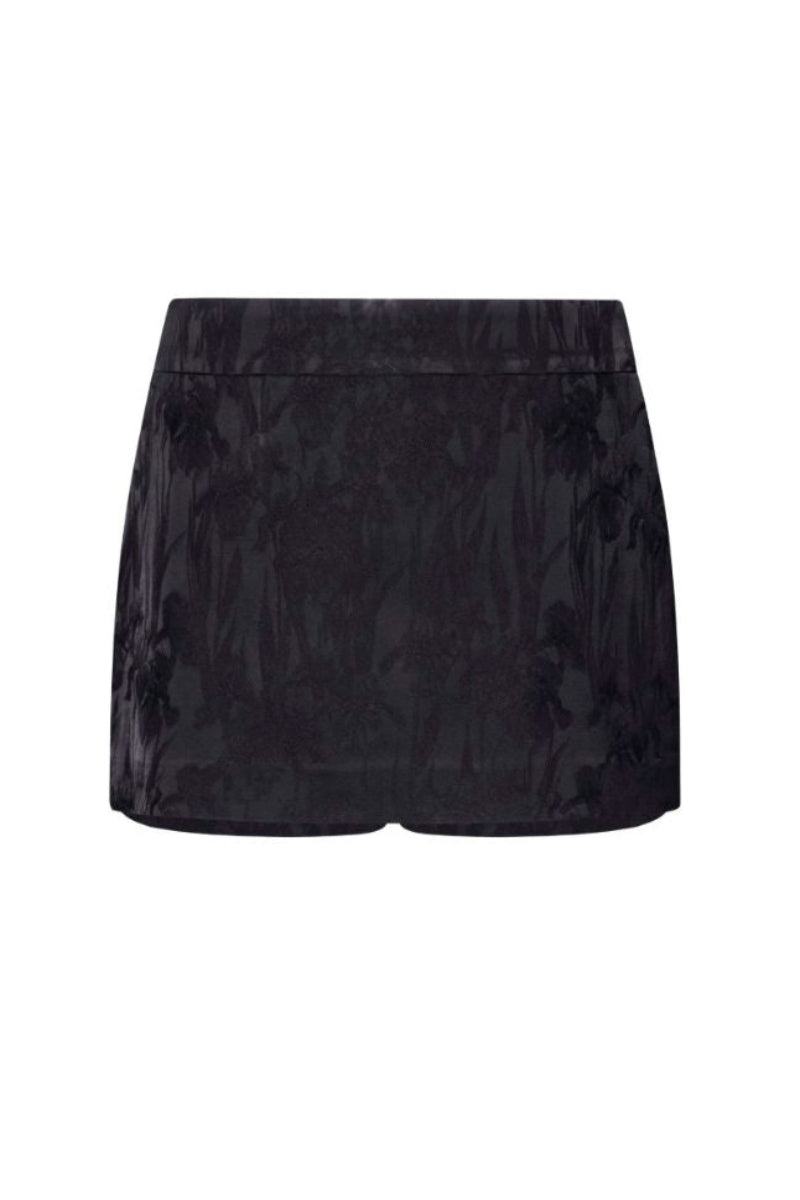 Black LEKIEU Amiens mini skirt displayed on a hanger, showcasing its sleek design and fitted silhouette.