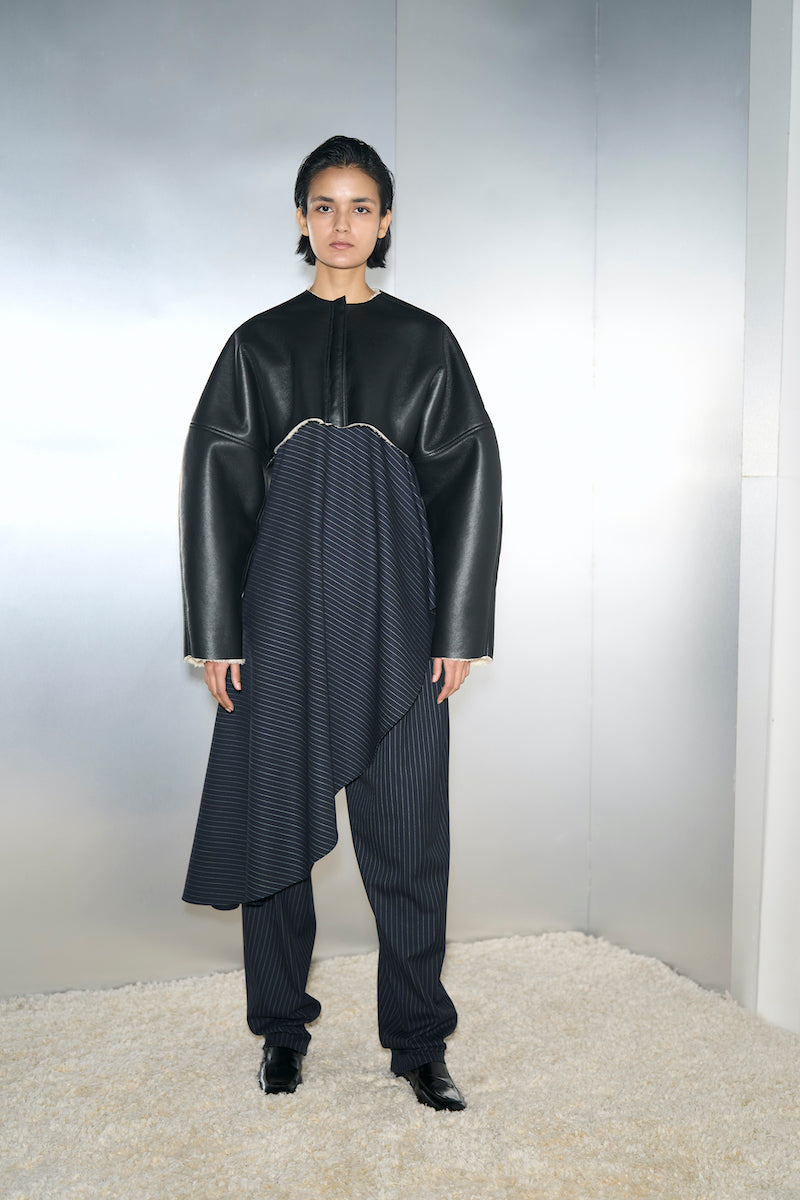 Black Adele bomber jacket by URA featuring a stylish, fitted design with ribbed cuffs and collar, perfect for casual wear.