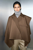 Ura IDA camel-colored jacket with a stylish cape design, featuring a tailored fit and textured fabric for a sophisticated look.