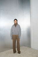Gray Ura Steph Jacket displayed on a hanger, showing its tailored fit, collar, and stylish design perfect for casual wear.