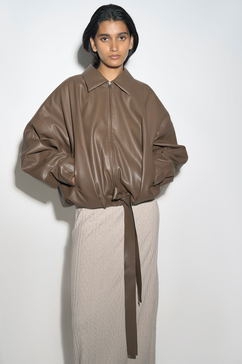 Ura RIA jacket in toffee color, stylish women's outerwear with a smooth fabric finish and classic design.