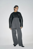 Black Ura Adele bomber jacket with ribbed cuffs and collar, showcasing a sleek, stylish design perfect for casual wear.