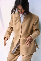 Ura Leah blazer in classic tailored design, featuring structured fit and sleek fabric for stylish office or casual wear.