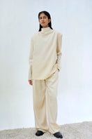Pair of URA ELI trousers in a stylish pants design, featuring a comfortable fit and modern silhouette.