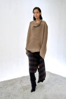 Cream-colored URA Alva Jumper sweater with a cozy knit texture, featuring a relaxed fit and ribbed cuffs.