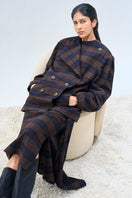 Ura Kari blazer in classic design, tailored fit, with lapel collar and button front, displayed on hanger.