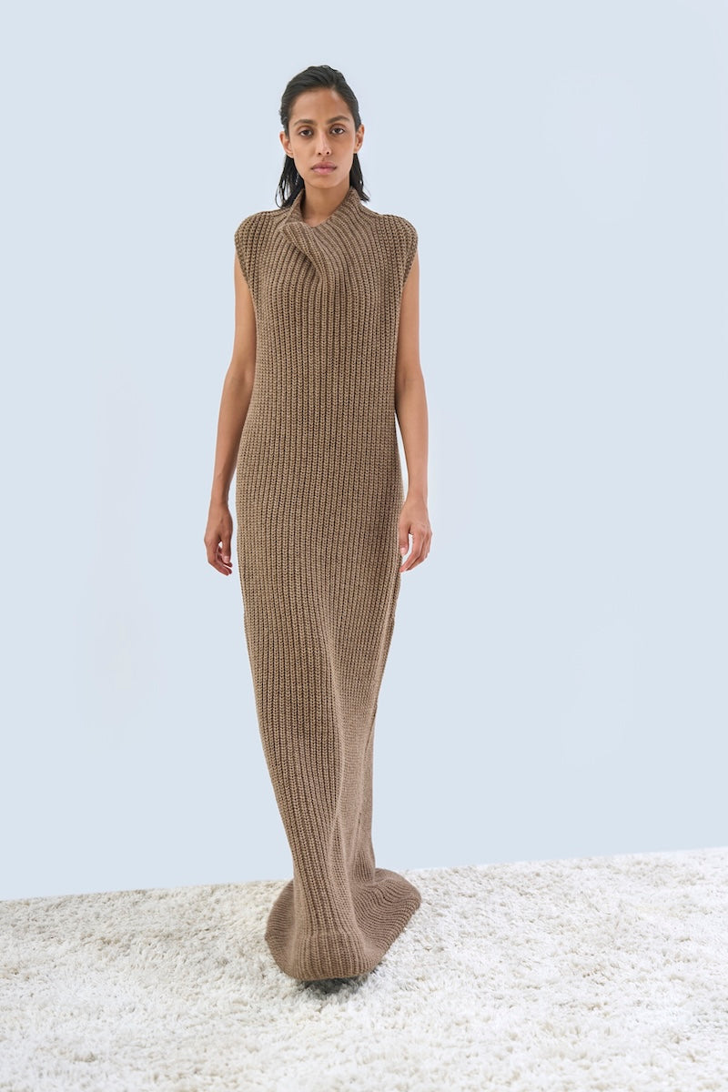 URAA maxi dress from the ALVA DRESS collection, featuring flowing fabric and elegant design, shown in a stylish full-length view.