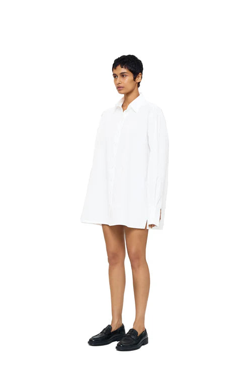 Light blue DIMA shirt by URA with a classic collar and button-down front, displayed on a hanger.