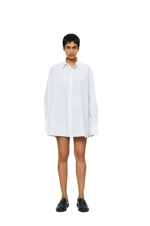 Blue DIMA shirt by URA, stylish button-up shirt with collar and long sleeves, displayed on a hanger.