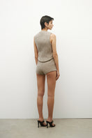 Cream-colored virgin wool vest with ceramic buttons, stylish and warm, by JC Pajares, shown on a neutral background.