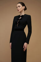 Black crepe de chine and velvet gown with a V-cut neckline and long sleeves, designed by I.H.F.