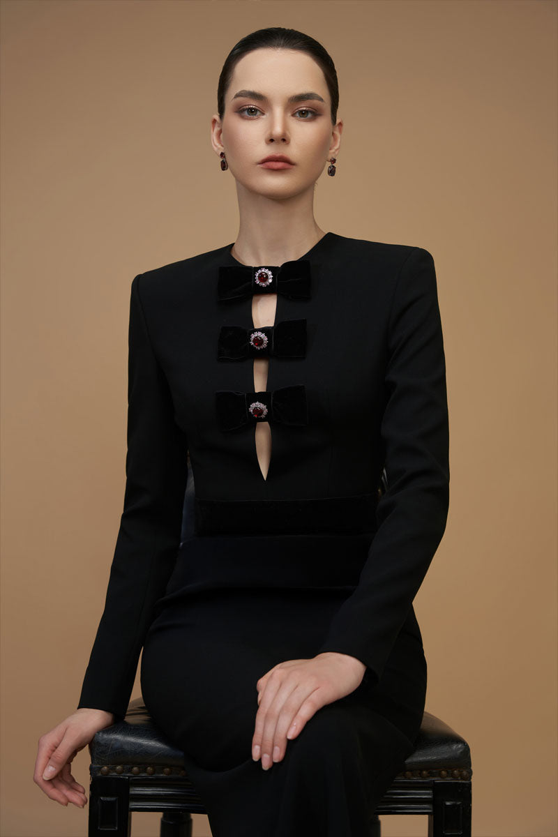 Elegant black crepe de chine and velvet gown with V-cut neckline and long sleeves, designed by I.H.F.