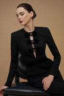 Black crepe de chine and velvet gown with a V-cut neckline and long sleeves, designed by I.H.F.