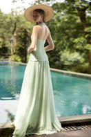 DOROTHEA mint silk pleated maxi dress by 21Six, flowing fabric with elegant pleats, sleeveless design, and a fitted waist.