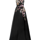 Black Tracy Studio gown with organza floral bead embellishments, featuring a flowing design and elegant details.