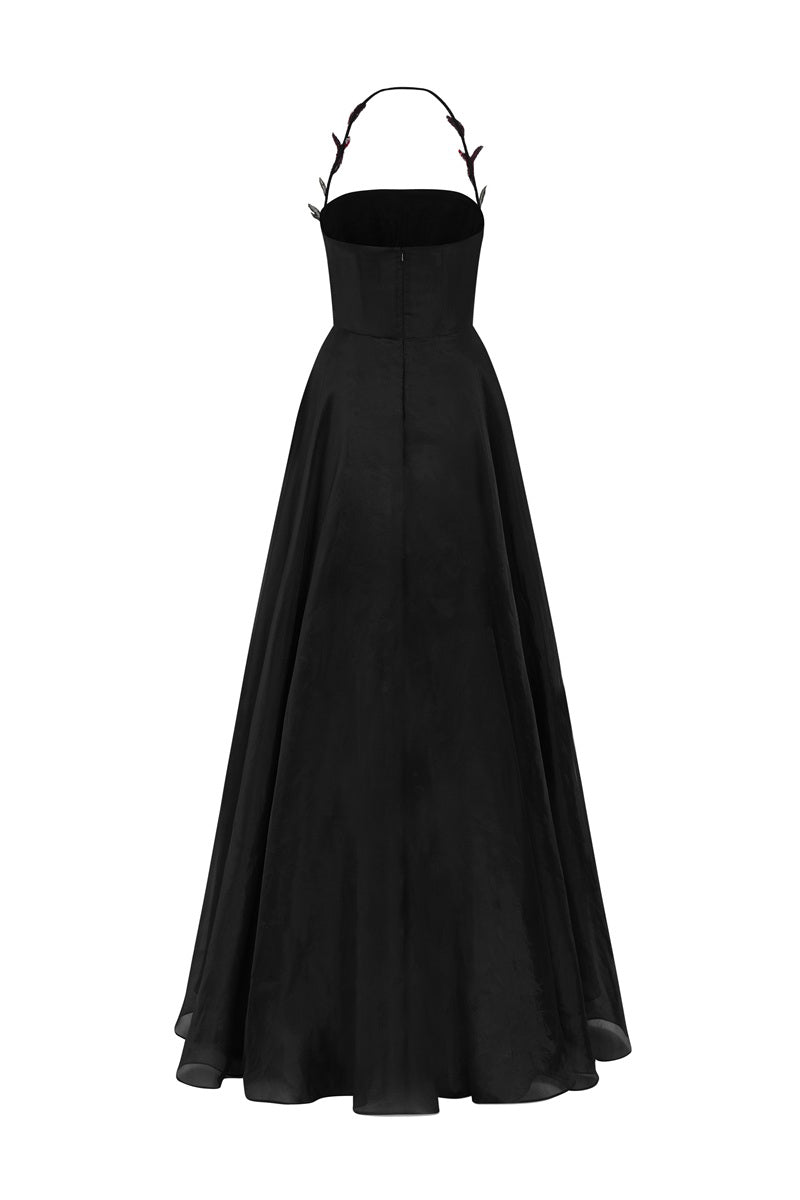 Black Tracy Studio maxi dress with floral bead embellishments and sheer organza fabric, designed for elegant occasions.