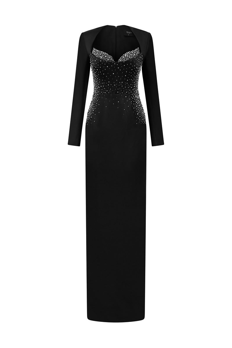 Black embellished maxi dress by Tracy Studio, featuring intricate beadwork and flowing fabric for elegant evening wear.