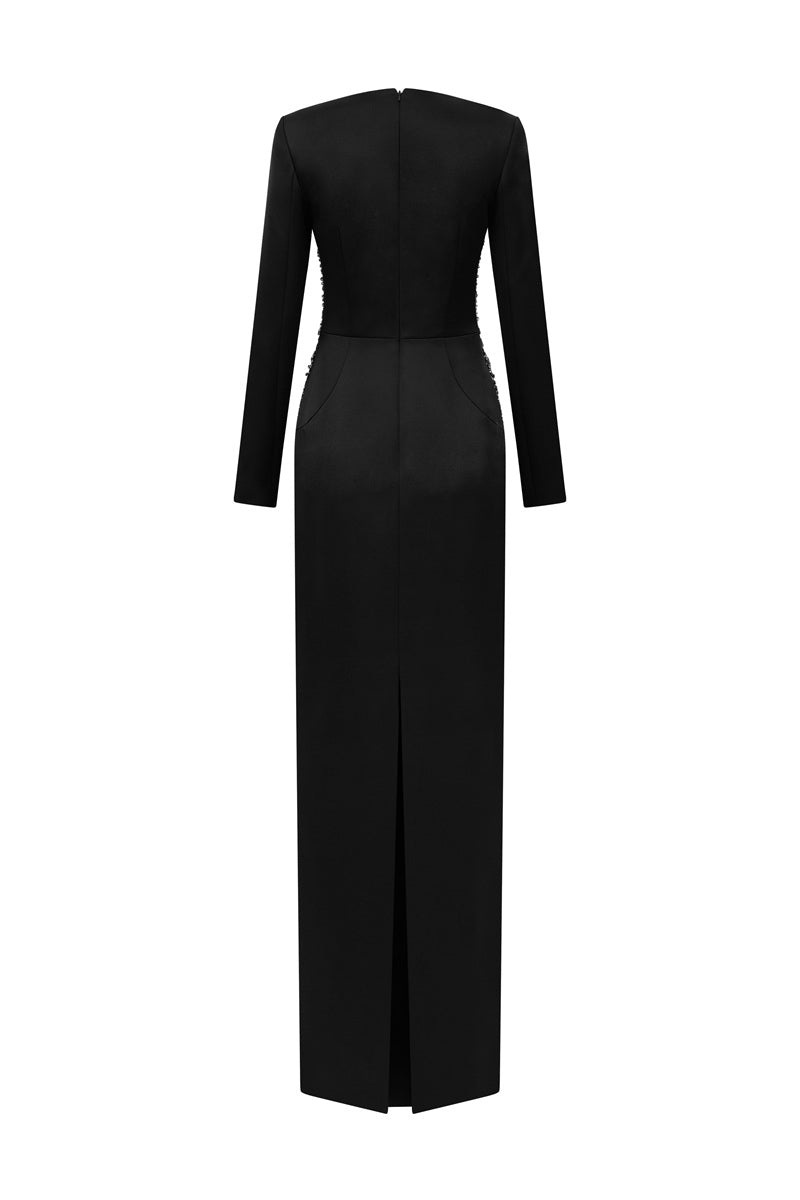 Black embellished maxi dress by Tracy Studio featuring intricate details and flowing fabric, perfect for elegant occasions.