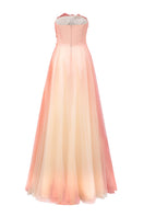 Elegant layered tulle gown by Tracy Studio featuring flowing fabric and intricate design, perfect for formal occasions.