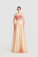 Elegant tulle layered gown by Tracy Studio featuring flowing fabric and intricate design, perfect for special occasions.