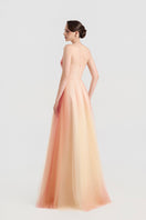 Elegant tulle layered gown by Tracy Studio featuring flowing fabric and intricate design, perfect for formal occasions.