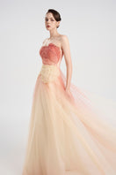 Elegant layered tulle gown by Tracy Studio featuring flowing fabric and intricate design, perfect for formal occasions.