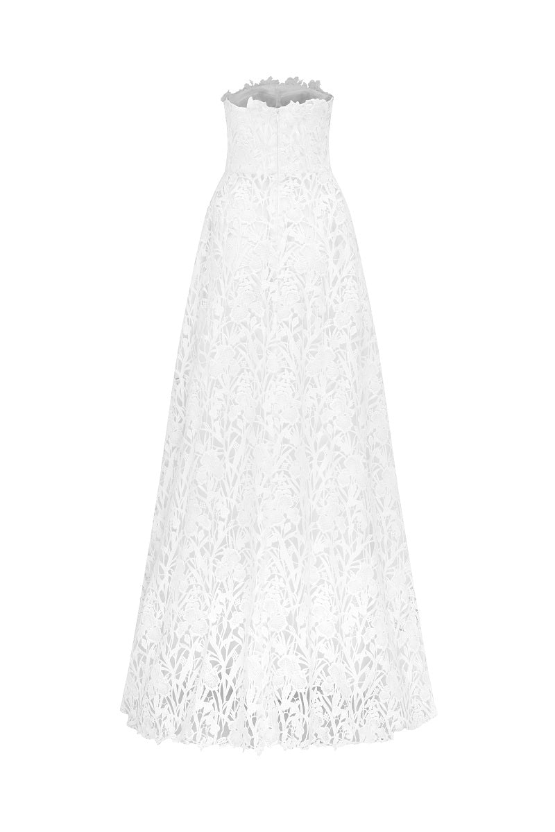 White lace beaded maxi dress by Tracy Studio featuring intricate lace details and flowing fabric for elegant occasions.