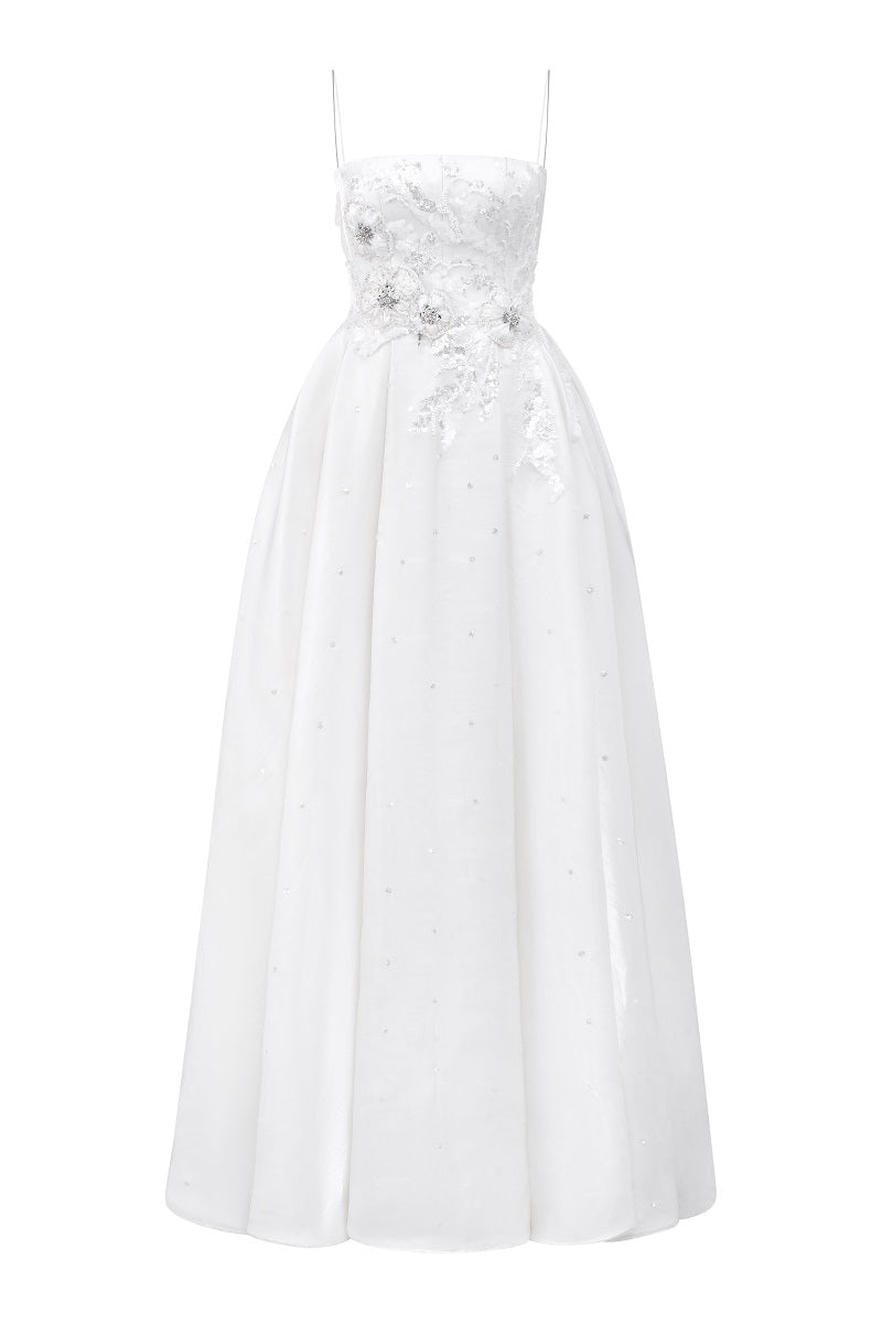 Off-white chiffon A-line maxi dress by Tracy Studio, flowing fabric and elegant silhouette showcased in this image.