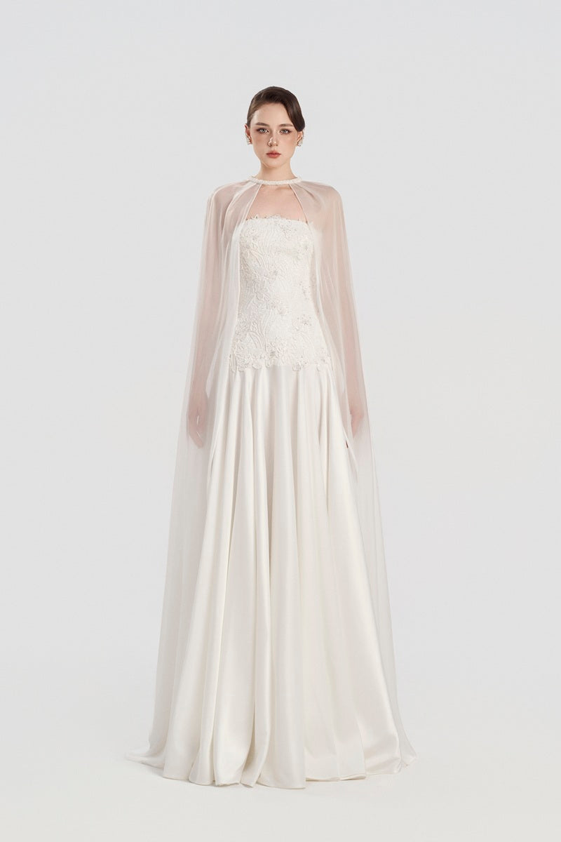 Elegant Tracy Studio taffeta maxi dress with matching cape, featuring a flowing silhouette and intricate detailing.