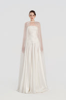Elegant taffeta gown with matching cape from Tracy Studio, featuring a flowing design and intricate details.
