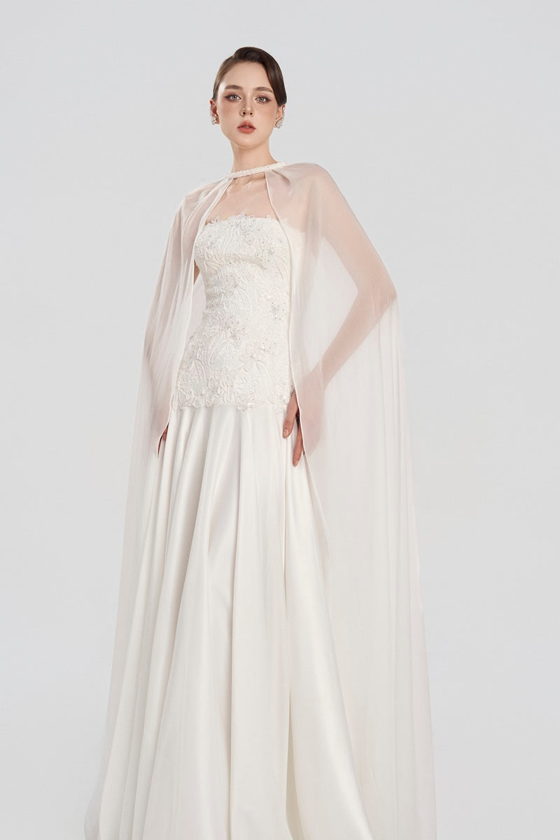 Elegant navy taffeta maxi dress with matching cape from Tracy Studio, featuring a flowing silhouette and sophisticated design.