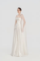 Elegant taffeta gown with cape by Tracy Studio, featuring a flowing design and sophisticated style.