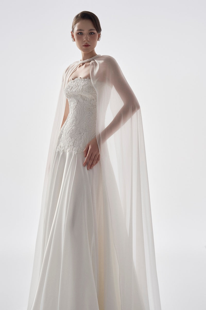 Elegant navy taffeta maxi dress with cape by Tracy Studio, featuring a flowing silhouette and stylish design.