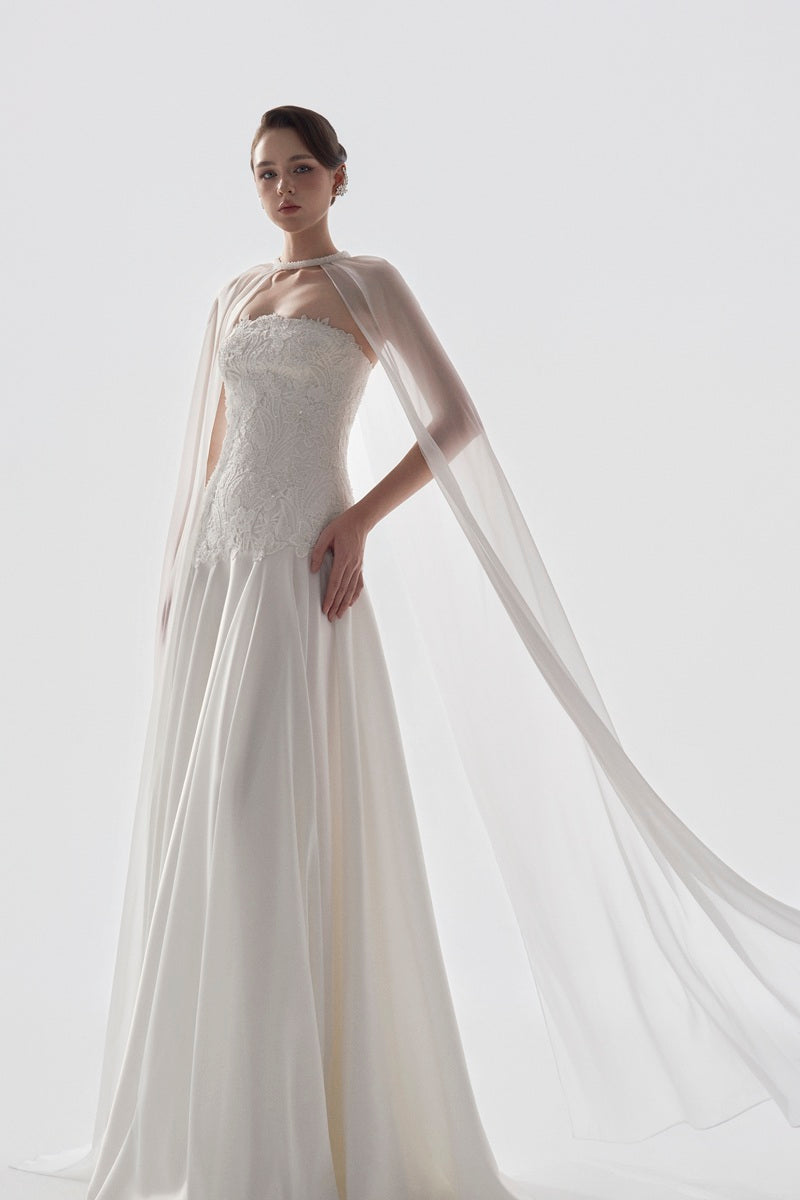 Elegant Tracy Studio taffeta maxi dress with matching cape, featuring a flowing silhouette and sophisticated design.