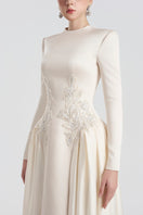 Elegant long sleeve taffeta mikado gown by Tracy Studio, featuring a fitted bodice and flowing skirt for formal occasions.