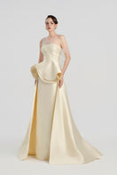 Elegant taupe taffeta bamboo peplum gown by Tracy Studio featuring a fitted bodice and flowing skirt.