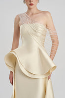 Elegant taffeta bamboo peplum gown by Tracy Studio featuring a flowing silhouette and intricate detailing.