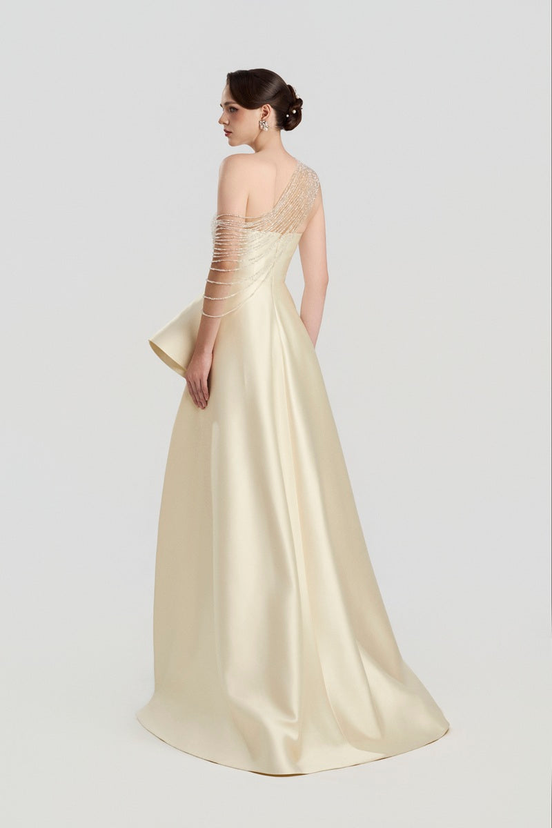 Elegant Tracy Studio taffeta bamboo peplum maxi dress, flowy fabric with a fitted bodice and peplum detail, perfect for formal occasions.