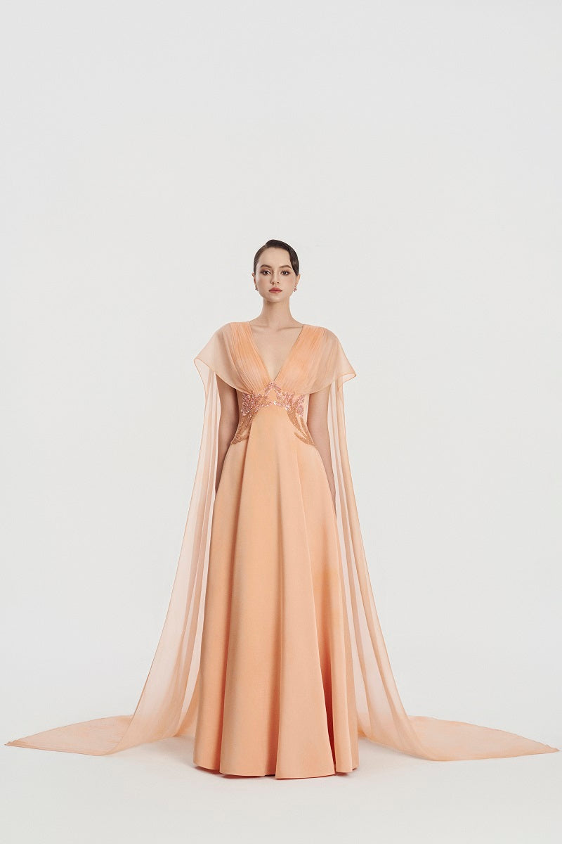 Deep V-neck satin maxi dress by Tracy Studio displayed on a hanger, showcasing smooth fabric and elegant design.