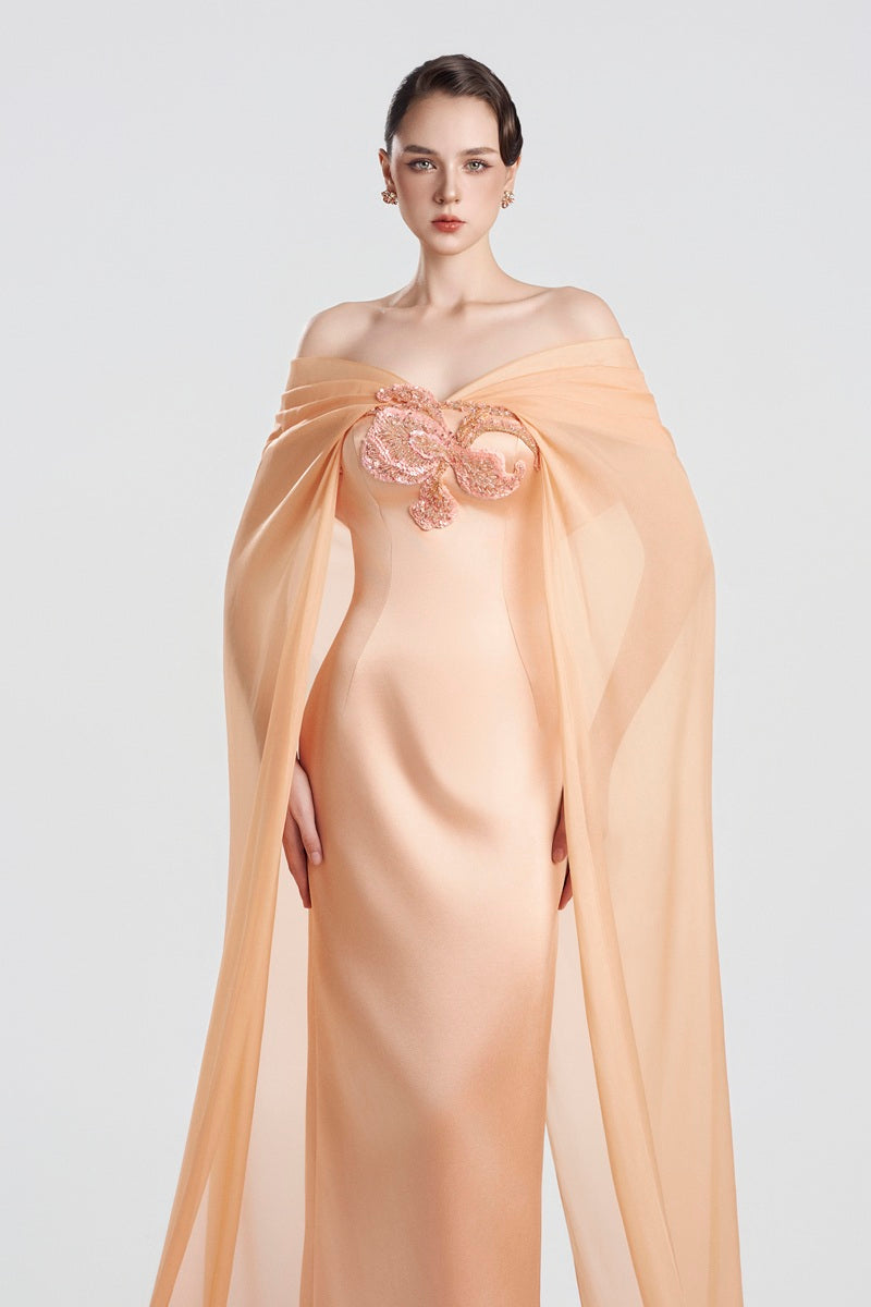 Elegant apricot taffeta mikado maxi dress by Tracy Studio, showcasing flowing fabric and sophisticated design.