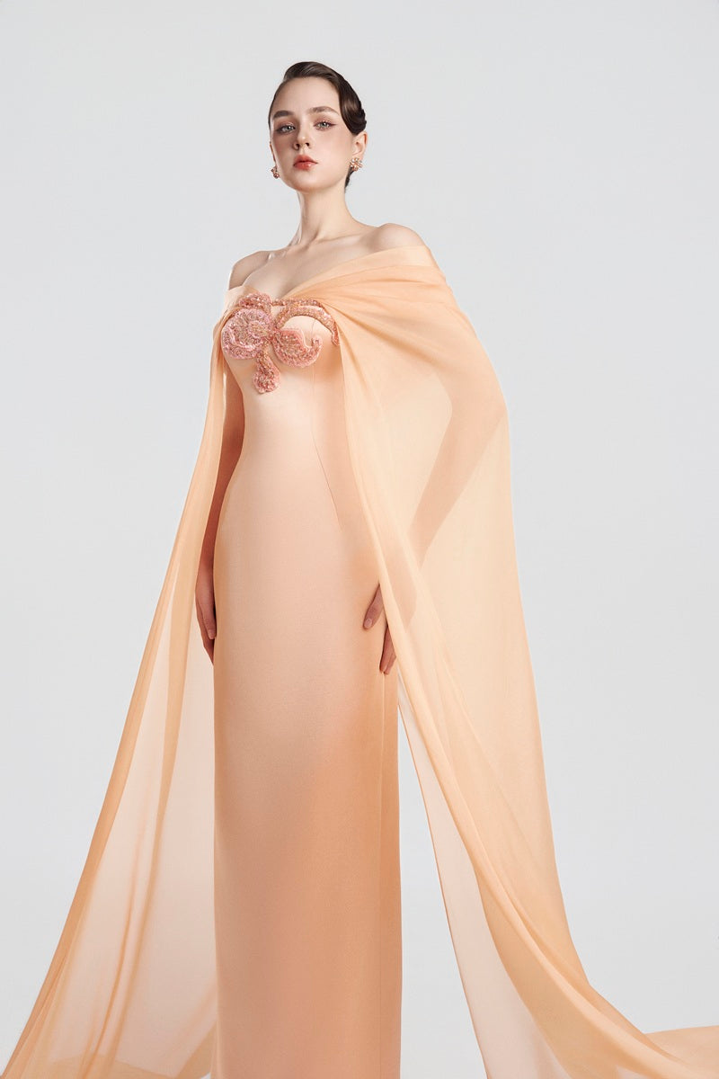 Flowy apricot taffeta mikado maxi dress by Tracy Studio, featuring elegant fabric and a graceful silhouette.
