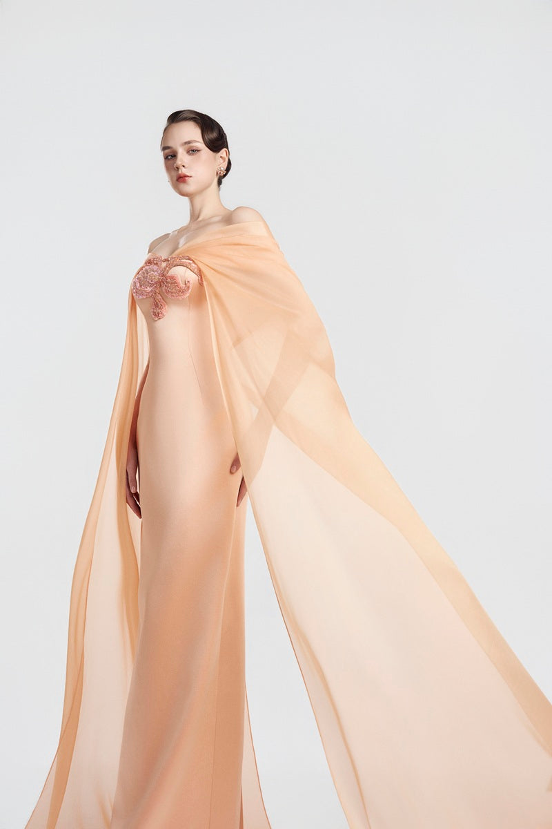 Apricot taffeta mikado maxi dress by Tracy Studio, elegant flowing fabric with a fitted bodice and full skirt.