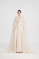 Off-white taffeta mikado gown by Tracy Studio with elegant, structured design and flowing silhouette, perfect for formal occasions.