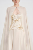 Elegant off-white taffeta mikado gown by Tracy Studio, showcasing a flowing design and intricate details.