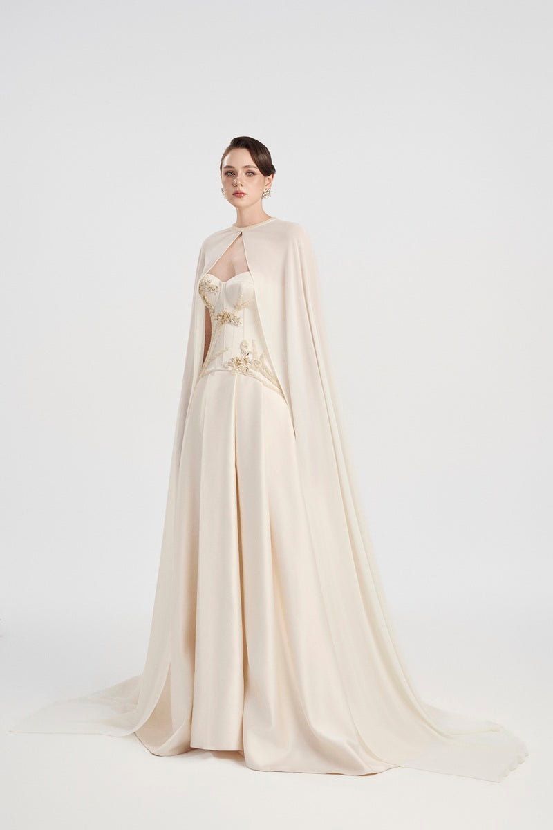 Off-white taffeta mikado maxi dress by Tracy Studio with a flowing silhouette and elegant design.